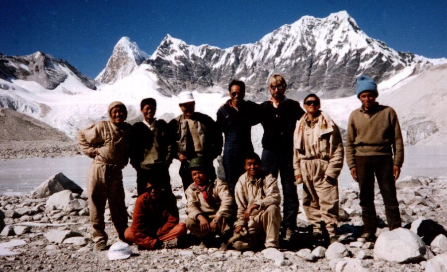 Trekking crew at Glacier Lake beneath Mingbo La and Ama Dablam