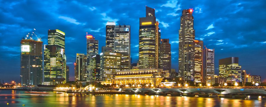 High Rise Buildings illuminated at night in Singapore city centre