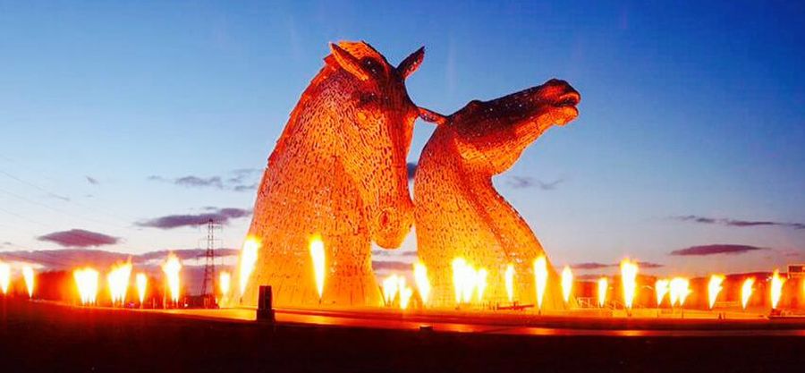 The Kelpies illuminated at night